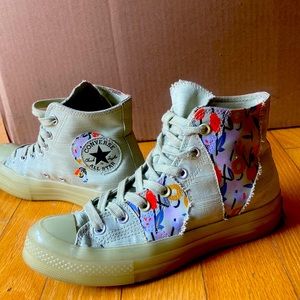 Rare unique pastel green high tops with floral designs on the sides.